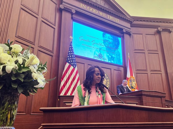 Florida State Sen. Rosalind Osgood leads her colleagues in prayer during a service celebrating the life of the late State Sen. Geraldine Thompson in the state capitol in Tallahassee, Fla. on Wednesday, March 13, 2025. (AP Photo/Kate Payne)