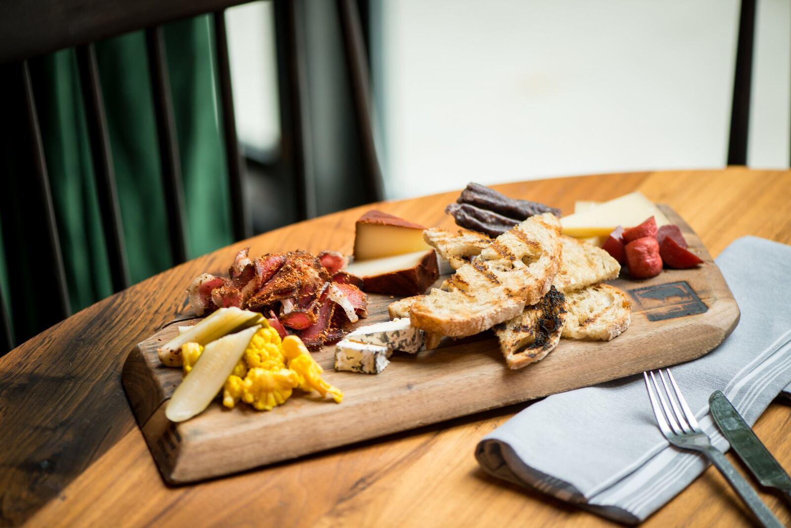 Biltong Bar Buckhead Biltong and Cheese plate with traditional, droewors, out of the ashes, griffin, alisios, house pickles, apricot chutney and grilled sourdough. Photo credit -Mia Yakel.