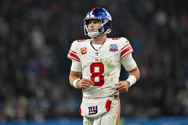 New York Giants quarterback Daniel Jones watches during the second half of an NFL football game against the Carolina Panthers, Sunday, Nov. 10, 2024, in Munich, Germany. (AP Photo/Lennart Preiss)