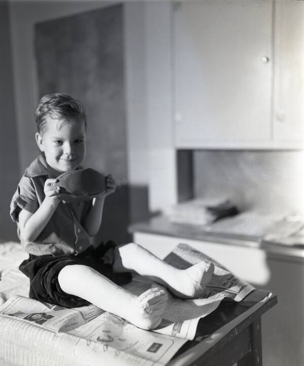 Polio stricken child before an examination, circa 1940s. AJC file.