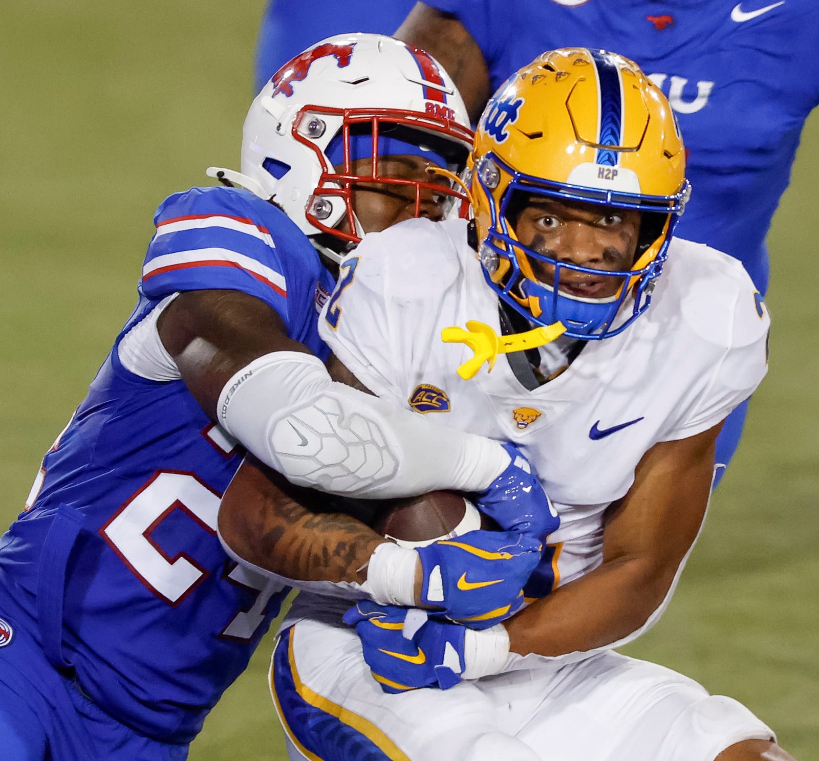 Pittsburgh wide receiver Kenny Johnson, right, is taken down by SMU linebacker Kobe Wilson, left, during the second half of an NCAA college football game in Dallas, Saturday, Nov. 2, 2024. (AP Photo/Gareth Patterson)