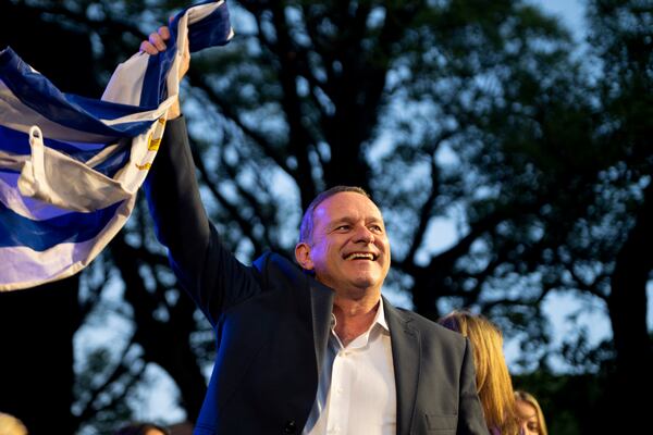 Alvaro Delgado, presidential candidate for the ruling National Party, holds his closing rally ahead of the presidential run-off election in Montevideo, Uruguay, Wednesday, Nov. 20, 2024. (AP Photo/Santiago Mazzarovich)