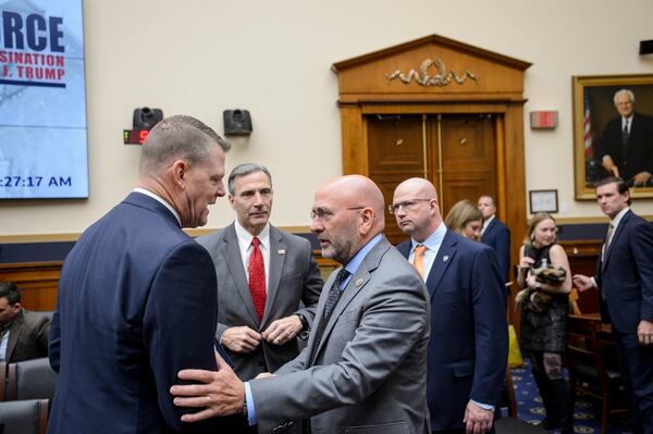 Secret Service Acting Director Ronald L. Rowe Jr., left, talks with Rep. Clay Higgins, R-La., following a hearing by the House Task Force on the Attempted Assassination of Donald J. Trump on the Secret Service's security failures regarding the assassination attempts on President-elect Trump, in Butler, Pa., July 13, 2024, and West Palm Beach, Fla., Sept. 15, 2024, on Capitol Hill, Thursday, Dec. 5, 2024, in Washington. (AP Photo/Rod Lamkey, Jr.)