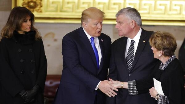 President Donald Trump and first lady Melania Trump, left, greet Franklin Graham and other family members of Rev. Billy Graham, as he lies in honor during a ceremony in the U.S. Capitol Rotunda, Wednesday, Feb. 28, 2018 in Washington. (Chip Somodevilla/Pool via AP)