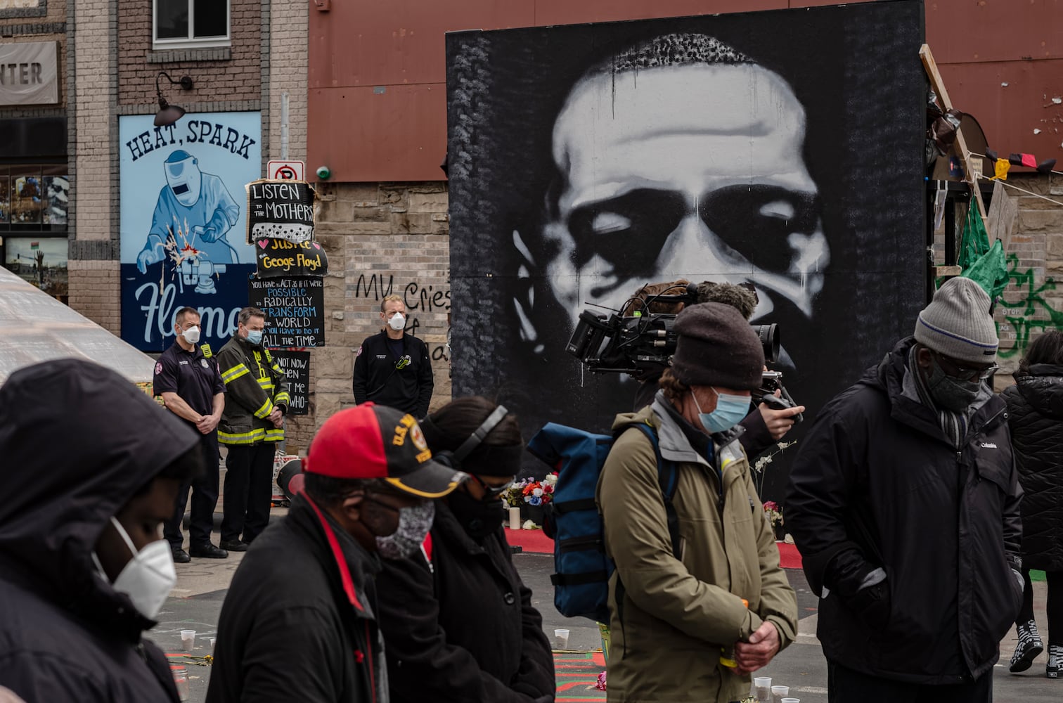 People pray near the George Floyd memorial in Minneapolis on Tuesday, April 20, 2021, as the jury prepares to deliver verdicts in the Derek Chauvin trial. (Amr Alfiky/The New York Times)