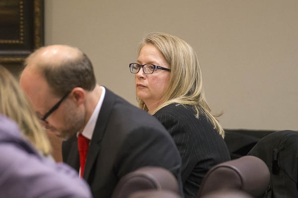 Fulton County Chief Financial Officer Sharon Whitmore sits with Fulton County attorneys in the courtroom of Judge Alan C. Harvey at the DeKalb County Courthouse in Decatur. Whitmore said more than $23 million could be at risk if the state is allowed to withhold grant money. (ALYSSA POINTER/ALYSSA.POINTER@AJC.COM) AJC FILE PHOTO