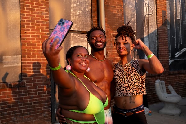 Brittney Jones, from left, Louis Ellos and Brian Smith take a photo at the Chaka Khan Hacienda party at Pullman Yards on Sunday, Sept. 10, 2023. Photo by Ben Gray 
ben@bengray.com