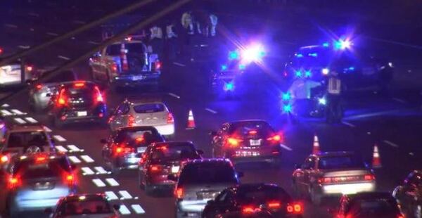 All southbound lanes were blocked Tuesday night after a woman was hit by three cars on the Downtown Connector. (Credit: Channel 2 Action News)