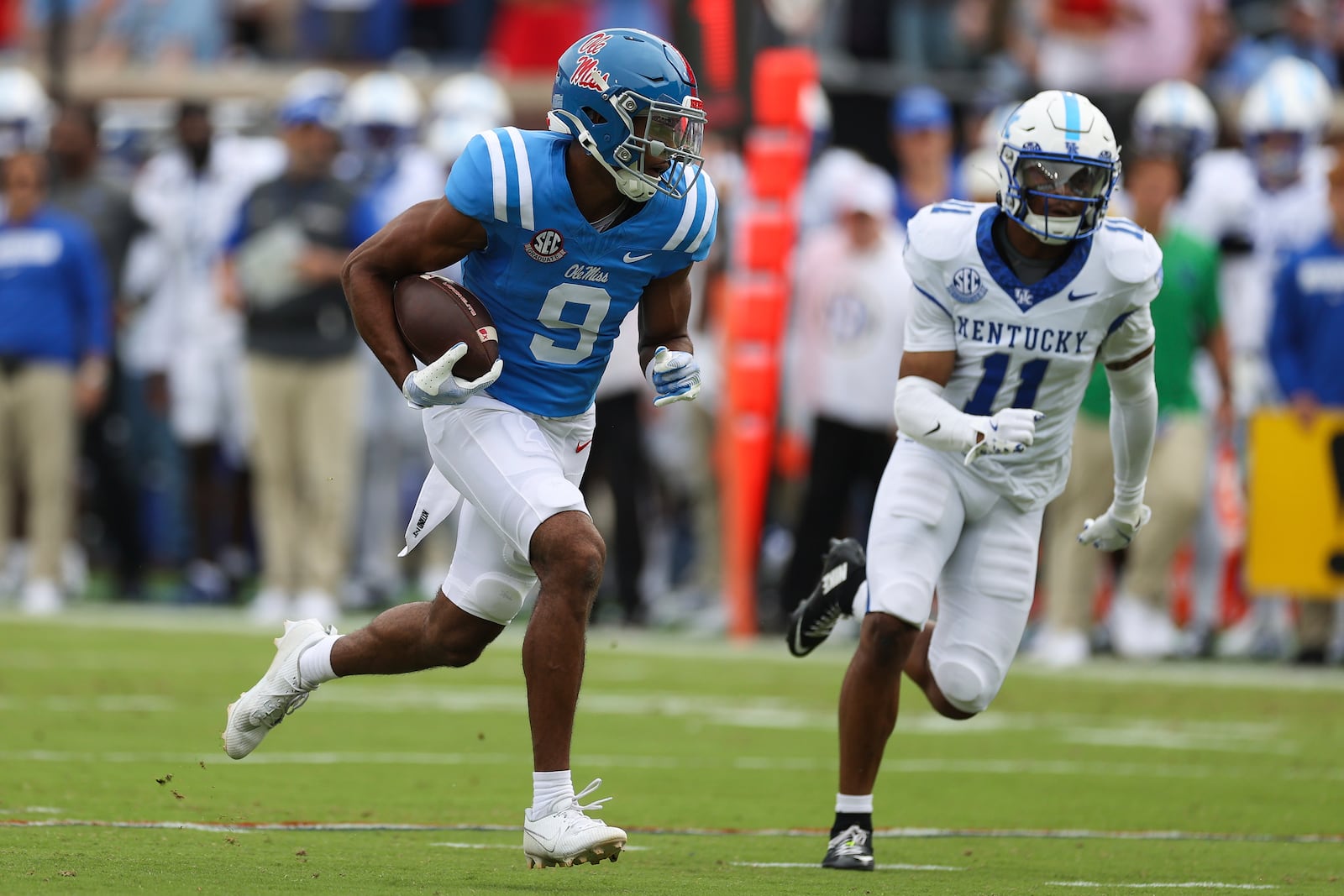 Mississippi wide receiver Tre Harris (9) runs the ball during the first half of an NCAA college football game against Kentucky Saturday, Sept. 28, 2024, in Oxford, Miss. (AP Photo/Randy J. Williams)