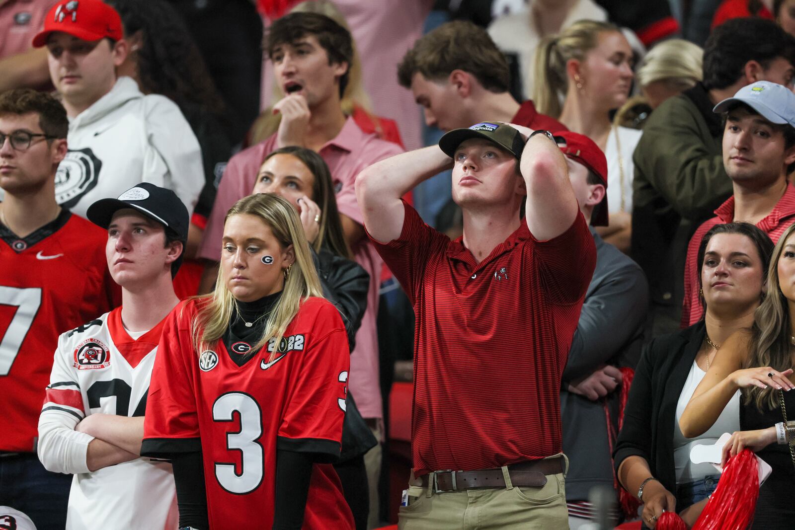 Georgia fans react after Alabama scored their last touchdown during the fourth quarter of Georgia’s loss to Alabama during the SEC Championship game at Mercedes-Benz Stadium, Saturday, December. 2, 2023, in Atlanta. Alabama won 27-24. (Jason Getz / Jason.Getz@ajc.com)