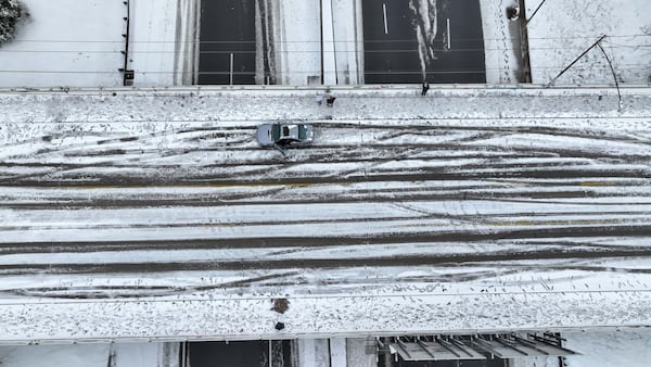 The Jackson Bridge in downtown Atlanta was covered in snow Friday and became slippery overnight. 