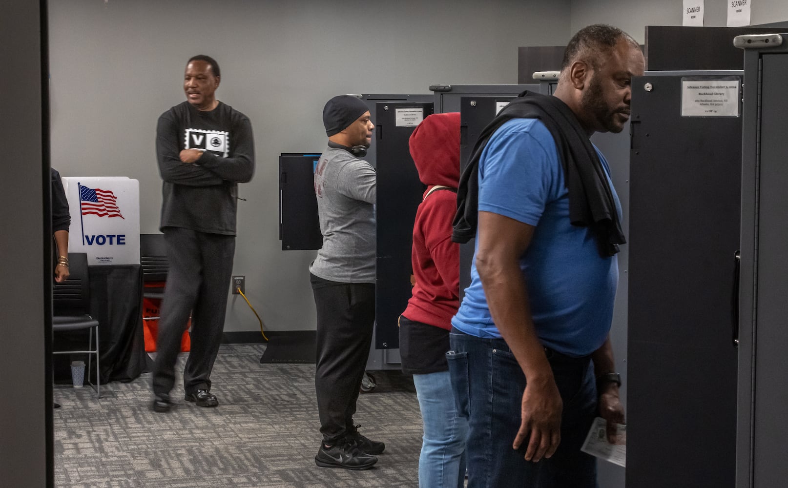 Voters enter the polls at the Buckhead Library in Atlanta on Friday, Nov. 1, 2024, on the last day of early voting in Georgia. The campaigns of Republican former President Donald Trump and Democratic Vice President Kamala Harris were working hard to get every last supporter to the polls.  (John Spink/AJC)