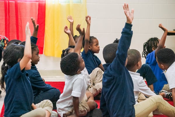 Students at Van Wilder Elementary School listen to their teacher in Jackson, Miss., on May 16, 2023. Mississippi has seen improvement in reading performance in recent years after investing more money in teacher training, literacy coaches and other initiatives. (Trent Bozeman/The New York Times)
                      