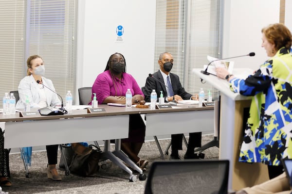 Atlanta Housing Authority members listen to Trish O'Connell, Deputy Chief Real Estate Officer, to the proposal to build affordable housing at the Civic Center grounds during the monthly board meeting at the Atlanta Housing Authority office on Wednesday, May 25, 2022. Miguel Martinez / miguel.martinezjimenez@ajc.com