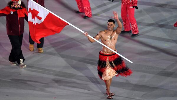 PYEONGCHANG-GUN, SOUTH KOREA - FEBRUARY 09:  Flag bearer Pita Taufatofua of Tonga and teammates enter the stadium during the Opening Ceremony of the PyeongChang 2018 Winter Olympic Games at PyeongChang Olympic Stadium on February 9, 2018 in Pyeongchang-gun, South Korea.  (Photo by Pool - Frank Fife/Getty Images)