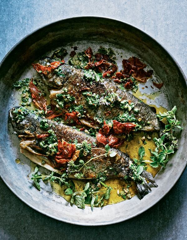 Ham-Stuffed Trout with Salsa Verde from "The Magic of Tinned Fish" by Chris McDade (Artisan Books, 2021). Photo by Dana Gallagher.