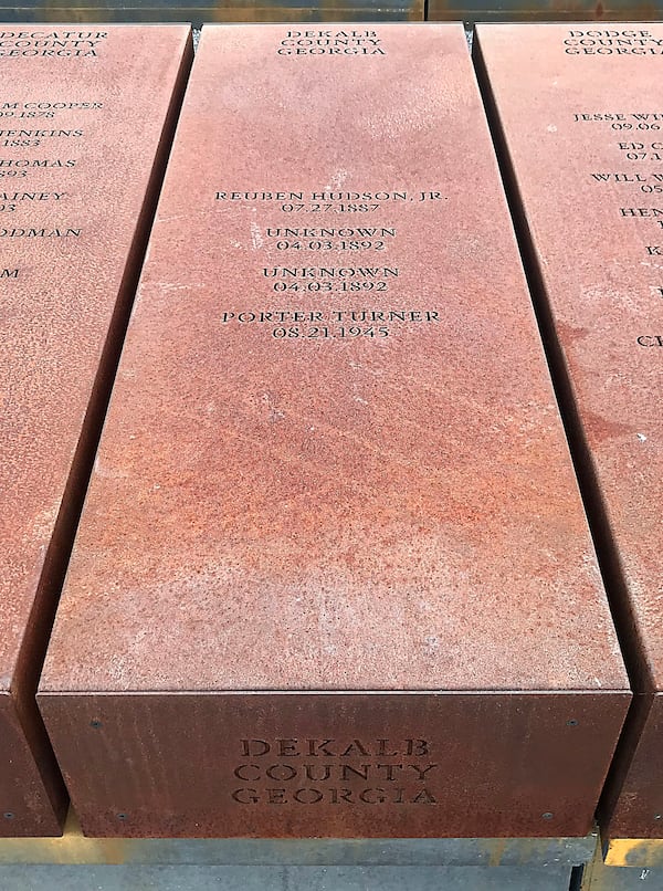  A stone marker at The National Memorial for Peace and Justice in Montgomery, Alabama recognizes several recorded lynchings that took place in DeKalb County.  TIA MITCHELL / TIA.MITCHELL@AJC.COM