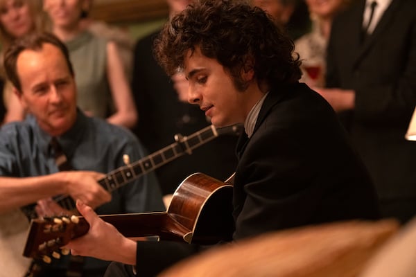 This image released by Searchlight Pictures shows Edward Norton, left, and Timothée Chalamet in a scene from "A Complete Unknown." (Macall Polay/Searchlight Pictures via AP)