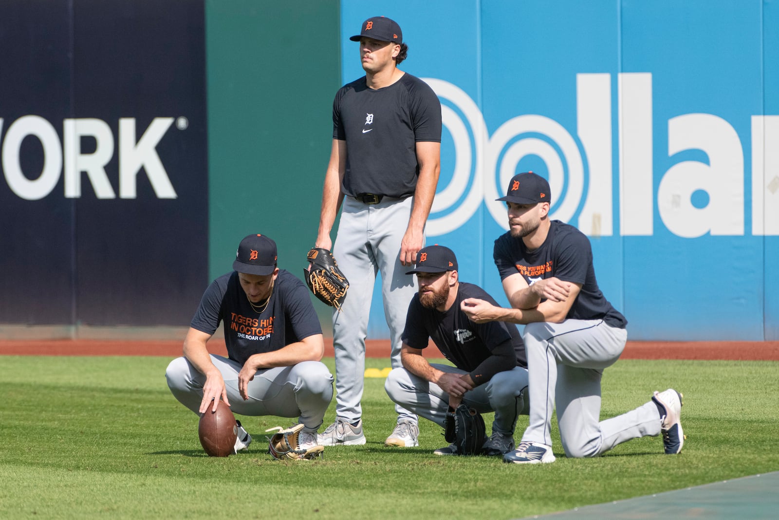 Detroit Tigers players, from left, Ben Brieske, Brant Hurter, Sean Guenther and Brenan Hanifee watch practice during a baseball workout in Cleveland, Friday, Oct. 11, 2024, in preparation for Saturday's Game 5 of the American League Division Series against the Cleveland Guardians. (AP Photo/Phil Long)