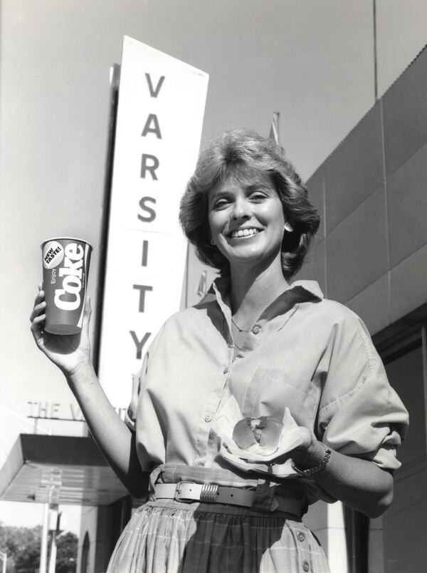 Nancy Simms, CEO of The Varsity restaurant, holds a "New Coke"  branded paper cup during the 1985 debut of the updated Coca-Cola. CONTRIBUTED: THE VARSITY