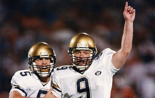 Georgia Tech kicker Scott Sisson (9) and holder Scott Aldredge (5) celebrate Sisson's game-winning, 37-yard field goal with 7 seconds left in the game to settle a frantic 41-38 come-from-behind victory over the top-ranked Cavaliers.