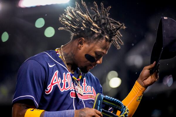 Atlanta Braves' Ronald Acuña Jr., walks into the dugout at the end of the eighth inning of a baseball game against the Washington Nationals at Nationals Park, Friday, Sept. 22, 2023, in Washington. (AP Photo/Andrew Harnik)