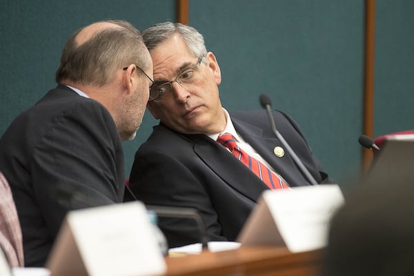 Incoming Georgia Secretary of State Brad Raffensperger, right, listens to state Rep. Barry Fleming (left) during a public hearing Thursday at the Coverdell Legislative Office Building in downtown Atlanta. The SAFE Commission, which Fleming helps lead as a co-chairman, held a public hearing Thursday to discuss and vote on recommendations for Georgia’s next voting system. (ALYSSA POINTER/ALYSSA.POINTER@AJC.COM)