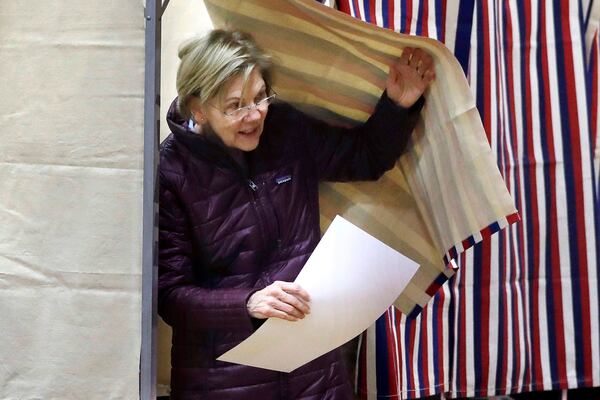 Democratic presidential candidate Sen. Elizabeth Warren, D-Mass., emerges from the booth with her ballot as she votes on Tuesday, March 3, 2020, in Cambridge, Mass. (AP Photo/Steven Senne)