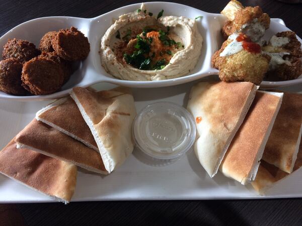 At Cafe Raik, you can build your own appetizer sampler: three choices for $10.95. The spread is shown here with falafel, hummus and fried cauliflower. CONTRIBUTED BY WENDELL BROCK