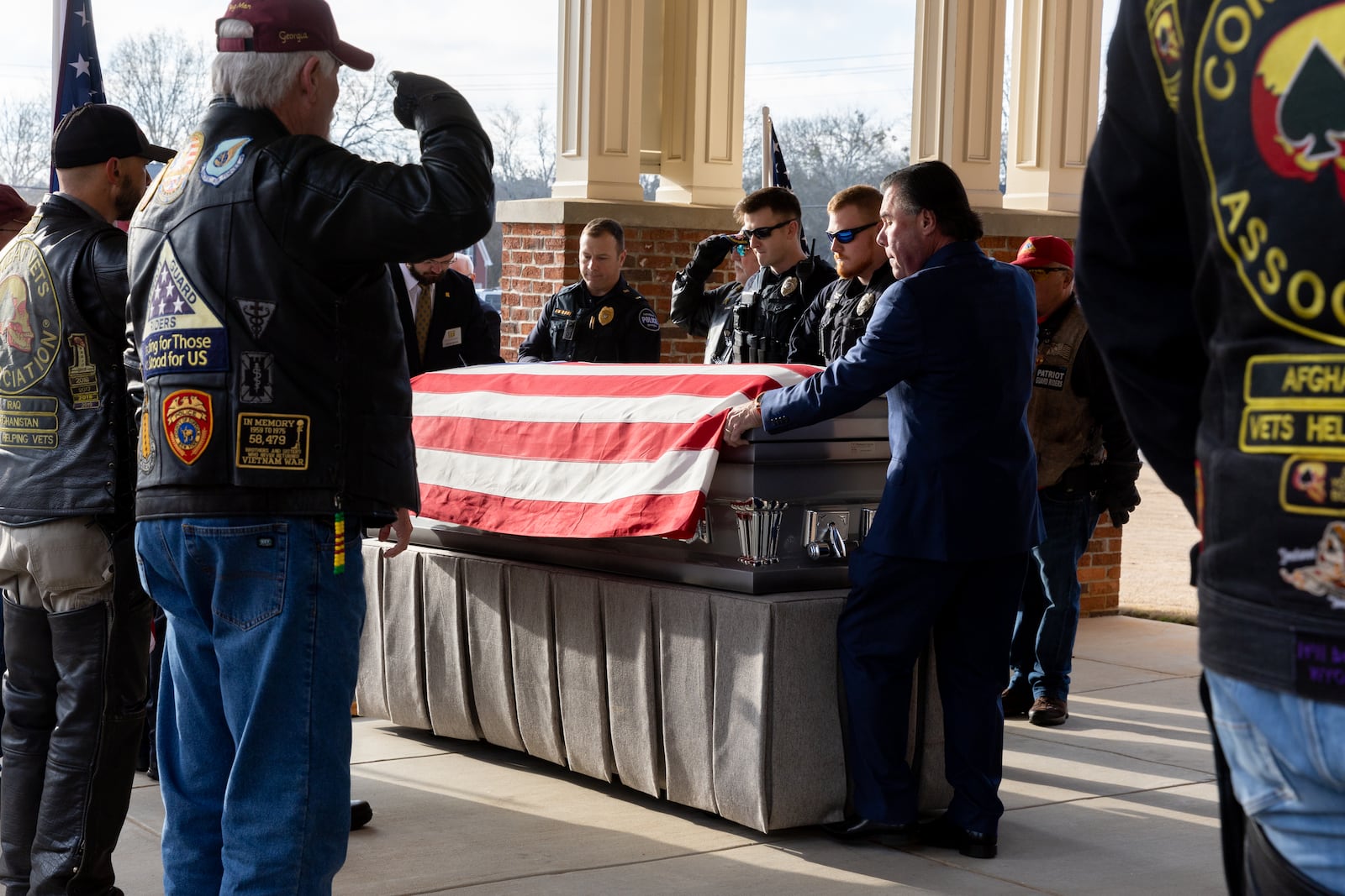 Staff Sgt. William Jerome Rivers' casket is brought into Tabernacle Baptist Church in Carrollton. (Arvin Temkar / arvin.temkar@ajc.com)