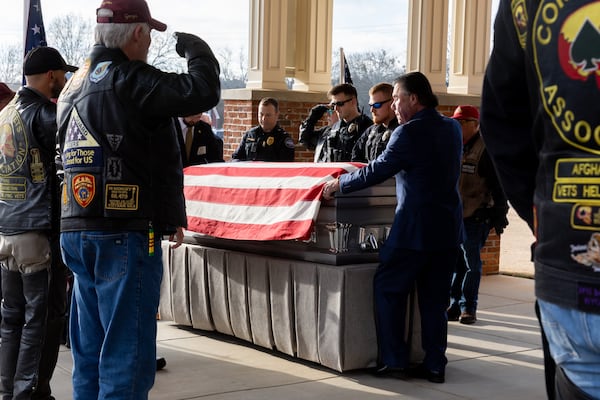 Staff Sgt. William Jerome Rivers' casket is brought into Tabernacle Baptist Church in Carrollton. (Arvin Temkar / arvin.temkar@ajc.com)