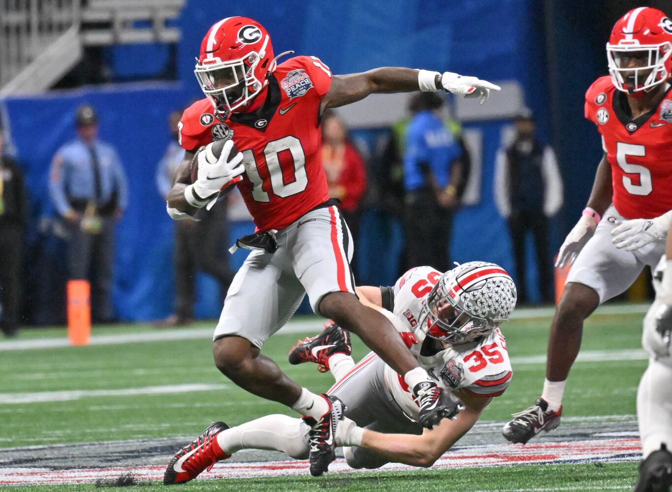 Georgia Bulldogs wide receiver Kearis Jackson (10) returns a punt during the third quarter of the College Football Playoff Semifinal between the Georgia Bulldogs and the Ohio State Buckeyes at the Chick-fil-A Peach Bowl In Atlanta on Saturday, Dec. 31, 2022. (Hyosub Shin / Hyosub.Shin@ajc.com)