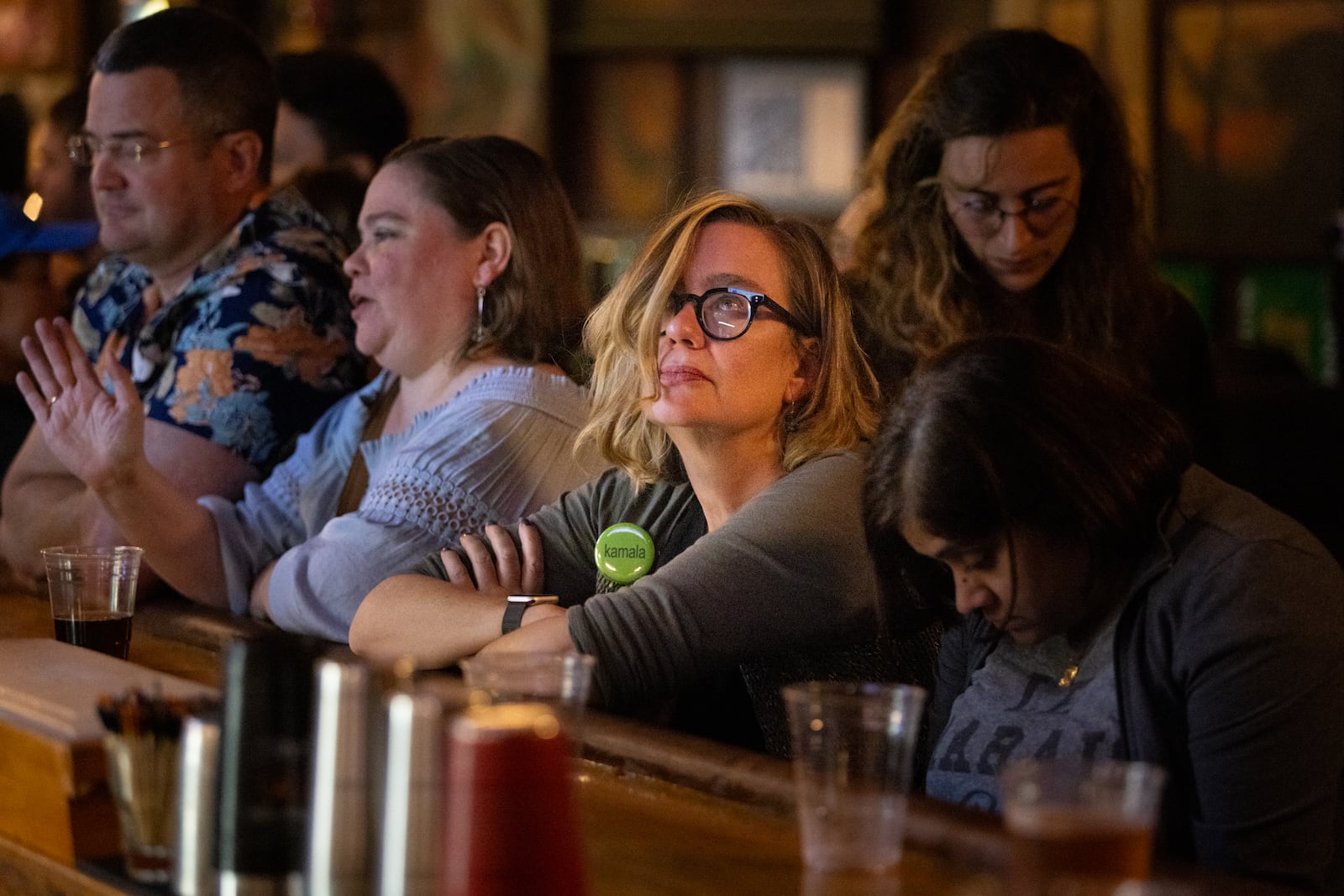 Patrons watch CNN on election night at Manuel’s Tavern in Atlanta on Tuesday, November 5, 2024. Republican presidential candidate Donald Trump won Georgia, according to a call by CNN. (Arvin Temkar / AJC)