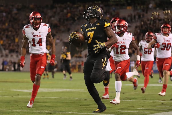 TEMPE, AZ - NOVEMBER 10:  Rrunning back Kalen Ballage #7 of the Arizona State Sun Devils runs with the football ahead of defensive back Brian Allen #14 and defensive back Justin Thomas #12 of the Utah Utes on a 71 yard reception during the first half of the college football game at Sun Devil Stadium on Novemebr10, 2016 in Tempe, Arizona.  (Photo by Christian Petersen/Getty Images)