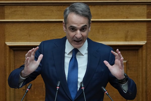 Greek Prime Minister Kyriakos Mitsotakis speaks in parliament ahead of the submission of a no-confidence motion by opposition parties over the government's handling of Greece's worst rail disaster two year ago, in Athens, Wednesday, March 5, 2025. (AP Photo/Thanassis Stavrakis)