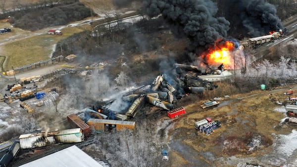 In this photo taken with a drone, portions of a Norfolk Southern freight train that derailed the previous night in East Palestine, Ohio, remain on fire at mid-day on Feb. 4, 2023. (Gene J. Puskar/AP)