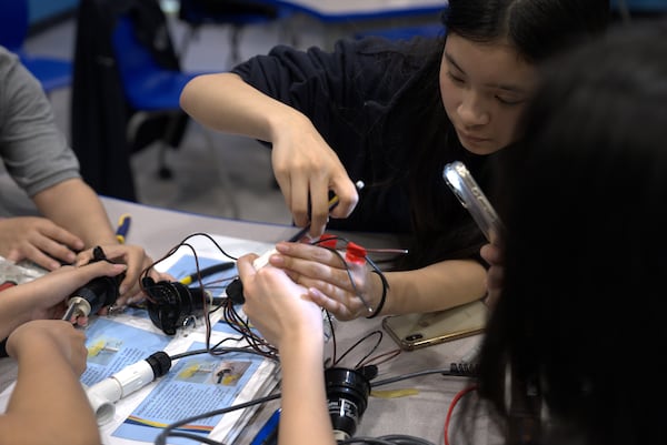 STEAM students from Gwinnett County's Sweetwater Middle School work on underwater remote-operated vehicles as part of a spring break program at the Georgia Aquarium. (Courtesy of Georgia Aquarium)