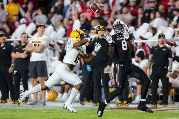 South Carolina wide receiver Nyck Harbor (8) makes a 43-yard reception over Missouri safety Daylan Carnell (13) during the first half of an NCAA college football game Saturday, Nov. 16, 2024, in Columbia, S.C. (AP Photo/Artie Walker Jr.)