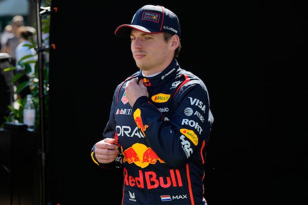 Red Bull driver Max Verstappen of the Netherlands reacts following the drivers portrait photo session ahead of the Australian Formula One Grand Prix at Albert Park, in Melbourne, Australia, Thursday, March 13, 2025. (AP Photo/Asanka Brendon Ratnayake)