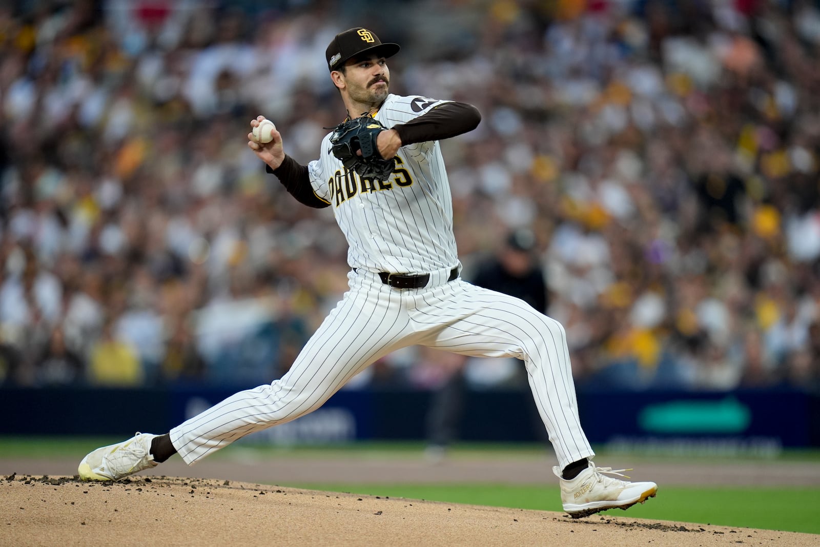 San Diego Padres starting pitcher Dylan Cease throws to a Los Angeles Dodgers batter during the first inning in Game 4 of a baseball NL Division Series Wednesday, Oct. 9, 2024, in San Diego. (AP Photo/Gregory Bull)