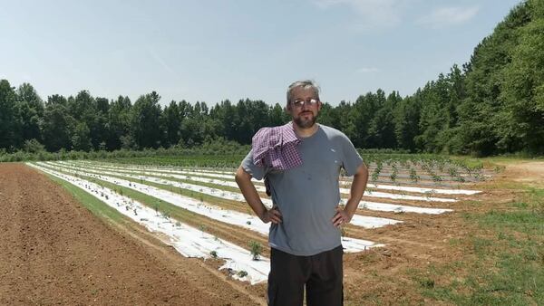 Michael Schenck of The Turnip Truck at Red Earth Organic Farms in Zebulon. (Photo credit: Paul Wages)