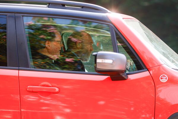 Stephen Lee (left) exits Fulton County Jail after surrendering on Friday, August 25, 2023. (Natrice Miller/natrice.miller@ajc.com)