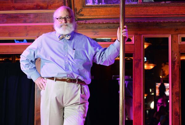 Atlanta lawyer Alan Begner, holding a pole onstage at Oasis Goodtime Emporium in 2013. (HYOSUB SHIN / HSHIN@AJC.COM)