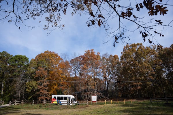 The Gwinnett Micro Transit bus pulls up to a suburban park to pick up passengers in Snellville, Georgia on Wednesday, Nov. 27, 2024 (Olivia Bowdoin for the AJC).