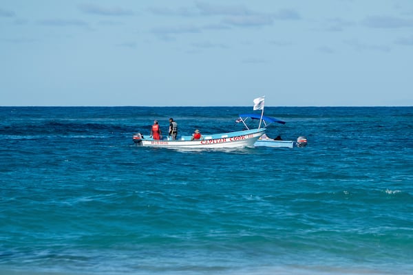 Civil defense boats search for Sudiksha Konanki, a university student from the U.S. who disappeared on a beach in Punta Cana, Dominican Republic, Monday, March. 10, 2025. (AP Photo/Francesco Spotorno)