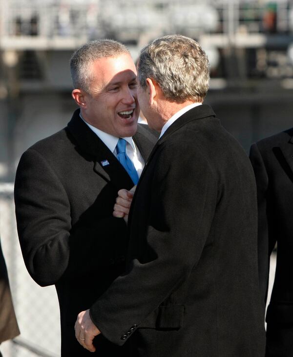 President George W. Bush is greeted by Bill White as he arrives to participate in the rededication ceremony of the Intrepid Sea, Air and Space Museum in New York in 2008. During White's time in charge of the museum, he built a Rolodex that rivaled any in New York. (Gerald Herbert / AP file)