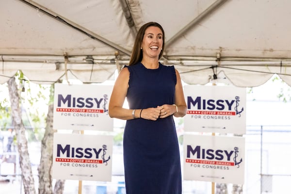 Missy Cotter Smasal addresses her supporters at Ballyhoos in Virginia Beach, Va., after winning the Democratic nomination in the race to represent the 2nd Congressional District in the U.S. House of Representatives, June 18, 2024. (Kendall Warner/The Virginian-Pilot via AP)