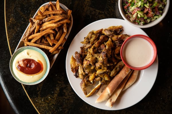 The mango aioli dipping sauce is a good reason to get fries with Nur Kitchen's chicken shawarma platter. (Mia Yakel for The Atlanta Journal-Constitution)