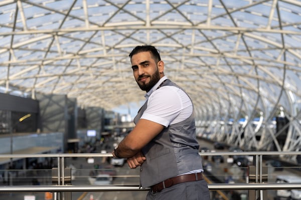 Mirwais Jalali, a recruiter for aviation contractor Unifi, poses for a portrait at Hartsfield-Jackson airport in Atlanta on Friday, April 19, 2024. (Arvin Temkar / arvin.temkar@ajc.com)