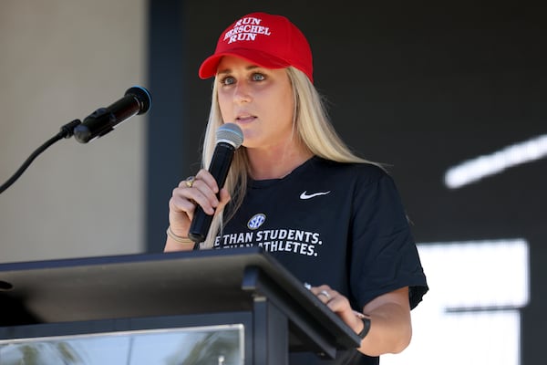 Former University of Kentucky swimmer Riley Gaines speaks during a campaign stop in Canton for Republican U.S. Senate candidate Herschel Walker. She opposes policies that allow transgender athletes to compete in sports that don't match the gender on their birth certificates. (Jason Getz / Jason.Getz@ajc.com)